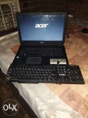 Black Laptop Computer With AC Adapter