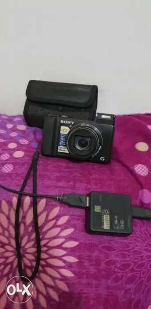 Black Sony Point-and-shoot Camera With Bag
