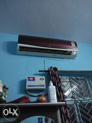 Maroon And White LG Split-type Air Conditioner