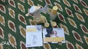 Medela imported White And Yellow Manual Breastpump for sale