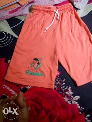 Orange Pinocchio-printed Shorts