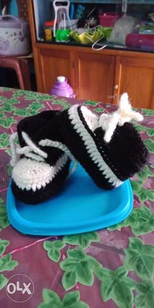 Pair Of Baby's Black Knitted Shoes