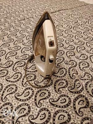 White And Silver Clothes Iron