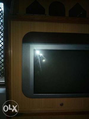 A colour tv with tv stand. in good running with