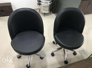 Two Black Leather Rolling Chairs