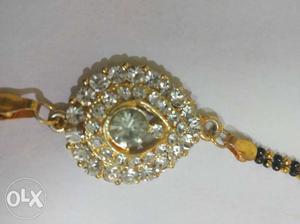 Gold-colored Jewelry With Clear Gemstones