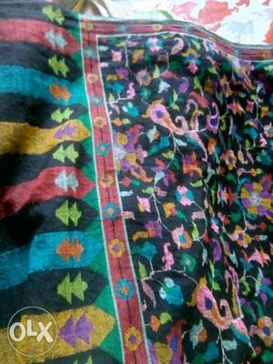 Green, Pink, And Black Floral Textile