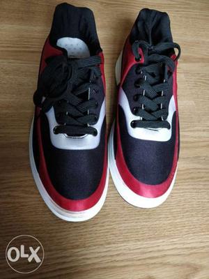 Pair Of Black & Red Nike Sneakers