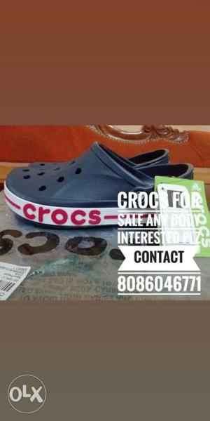 Pair Of Black-and-white Crocs Clog Shoes