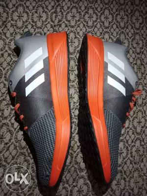Pair Of Gray-and-Red Adidas Shoes