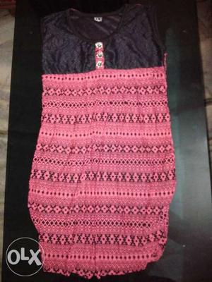 Pink and black coloured top. material is very