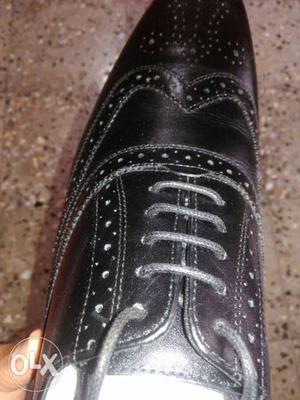 Unpaired Black Leather Dress Shoe