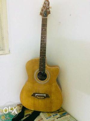 1 yr old guitar with belt and beg 7.