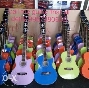 Blue, Pink, And Brown Cutaway Guitar Lot