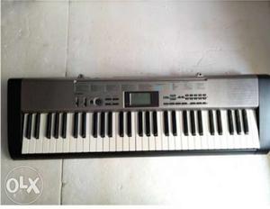 Gray And White Electronic Keyboard