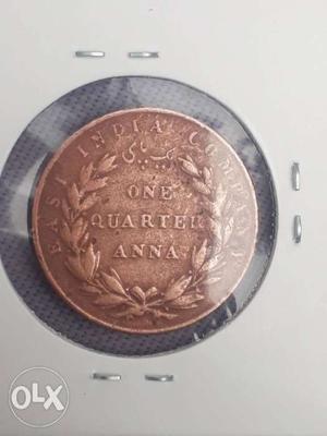 Round Copper-colored One Quarter Anna Coin