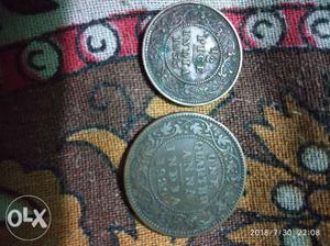 Two Round Gray 1 Indian Coins