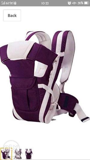 Baby shoulder carry bag with adjustable straps.