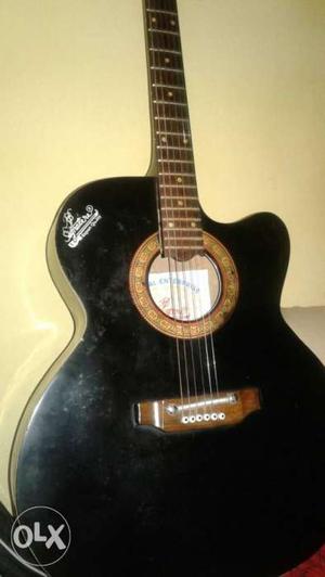 Black And Brown Wooden Guitar