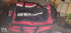 Black And Red Duffel Bag and 2 pair batting pads