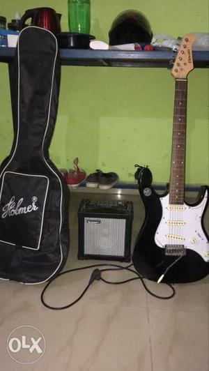Black Electric Guitar With Gig Bag And Amplifier