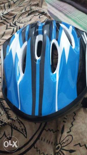 Blue And White Bicycle Helmet