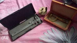 Gray Caliper With Case And Silver Micrometer With Case