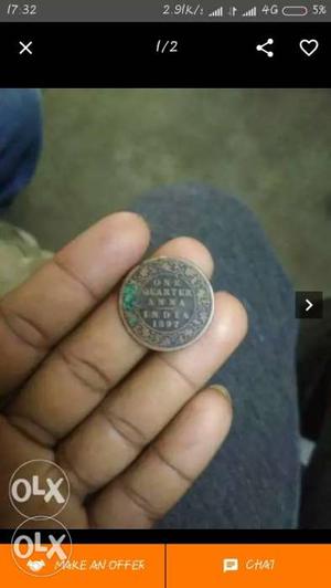 Indian quarter anna coin from year 
