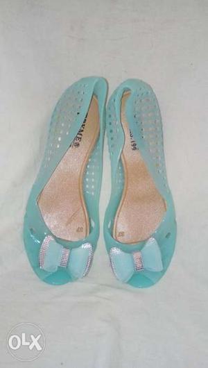 Pair Of Teal Leather Flat Shoes