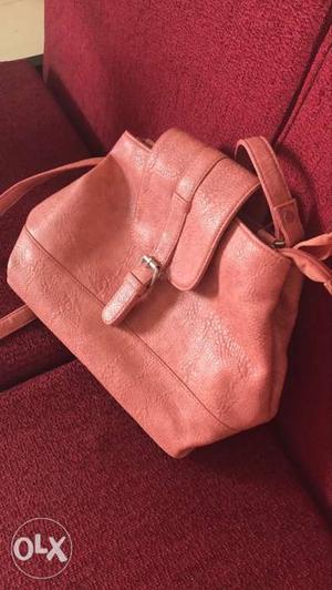 Pretty peach handbag. Has two compartments. Very