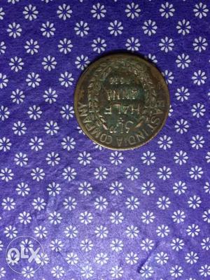 Round Bronze-colored Half Anna Indian Coin