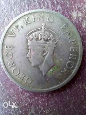 Round Silver-colored British Pence Coin