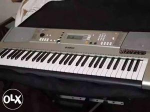 Silver Yamaha Electronic Keyboard