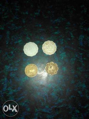 Three old ten paisa and one twenty paisa coins
