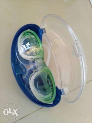 White and green swimming goggles