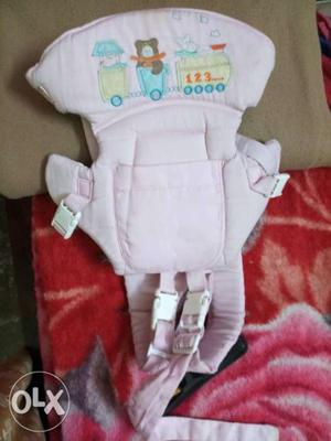 Baby's White And Pink Carrier