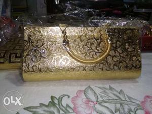 New, Golden Hand purse. (Fixed price Rs. 100)