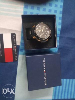 One yr old tommy watch with warranty card