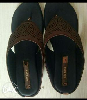 Pair Of Black-and brown Sandal