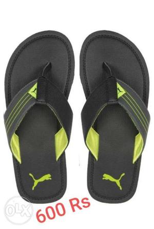 Pair Of Black-and-green Under Armour Sandals