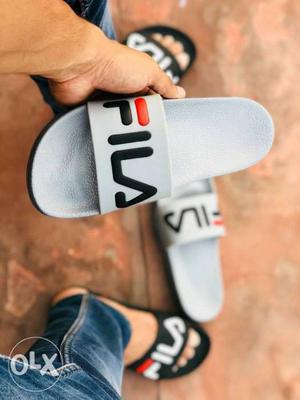 Pair Of Fila Slide Sandals