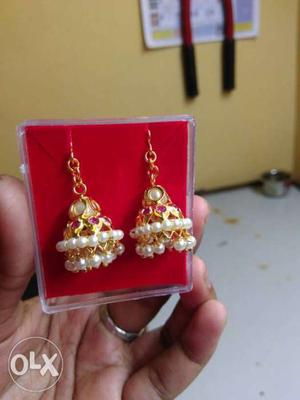 Pair Of Gold-colored Jhumka Earrings With Bead