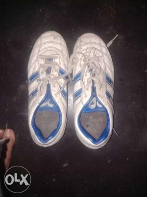 Pair Of White-and-blue Adidas Running Shoes