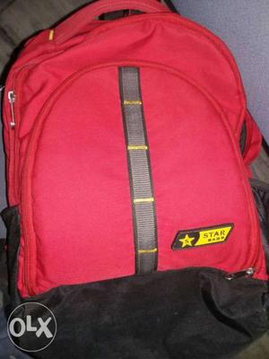 Pink, Black, And Yellow Star Brand Backpack
