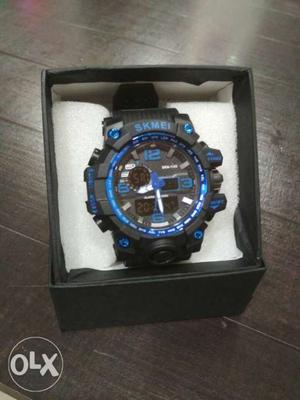 Round Black And Blue Digital Watch With Black Strap