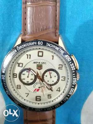 Round Silver-colored Chronograph Watch With Brown Leather