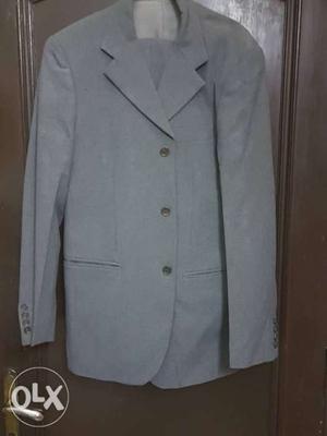 Benetton grey suit size 38 in good condition.