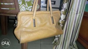 Branded mustard colour bag. 3 main compartments,
