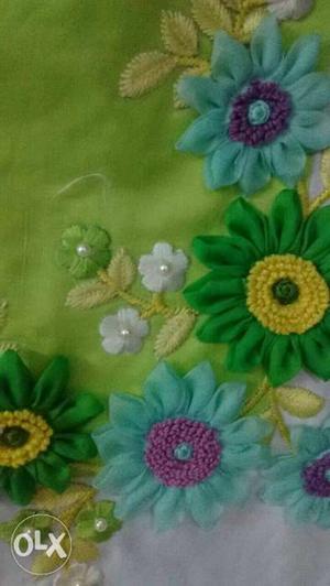 Green, Yellow, And Purple Floral Textile