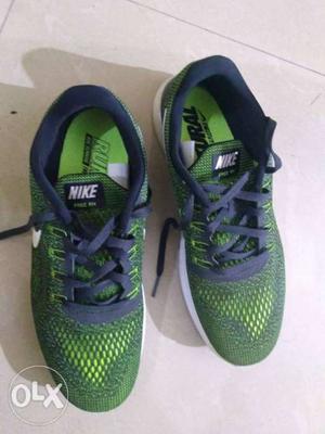 Green-and-black Nike Running Shoes